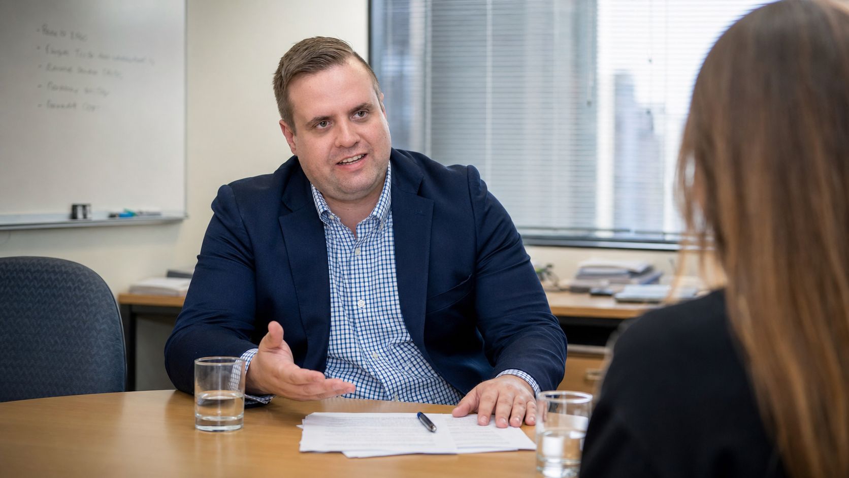 Brandon from Defy IT briefing a financial services client across a boardroom table