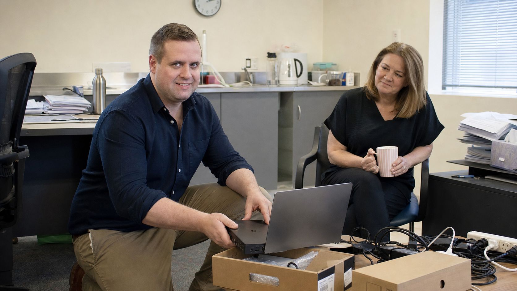 Brandon from Defy IT setting up new hardware in a client's office